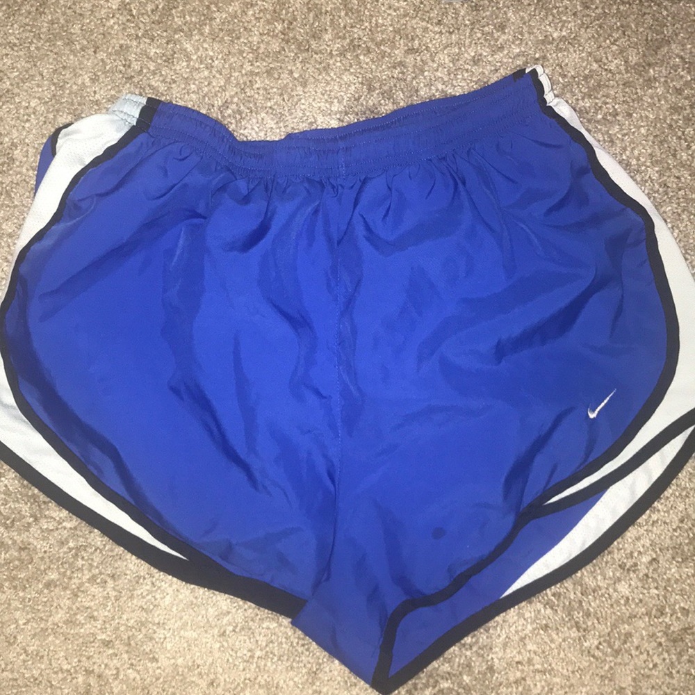 Size large black and blue nike shorts.